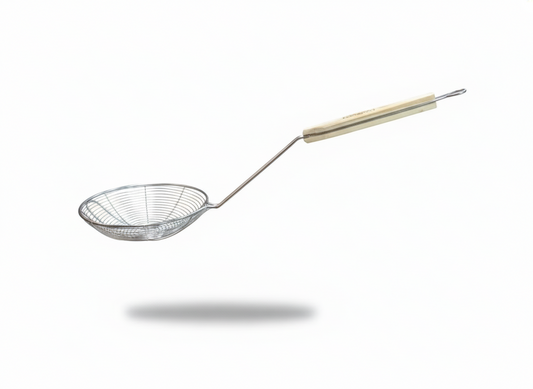 A metal spider strainer with a long handle and a light-colored wooden grip, shown floating against a plain white background with a soft shadow below.